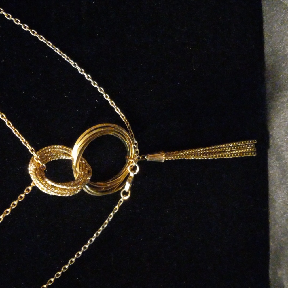 Long gold tone multi circle necklace